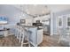 Open kitchen with granite counters, stainless steel appliances, and breakfast bar seating at 97 Kettle Harbor Dr, Placida, FL 33946