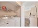 Laundry room with updated appliances and access to other parts of the house at 97 Kettle Harbor Dr, Placida, FL 33946