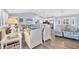 Open-concept living and kitchen area with vaulted ceiling and stylish furnishings at 97 Kettle Harbor Dr, Placida, FL 33946