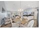 Open floor plan with a dining table, kitchen, and living area at 97 Kettle Harbor Dr, Placida, FL 33946