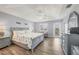 Spacious main bedroom with wood floors, tray ceilings, and a cozy sitting area at 97 Kettle Harbor Dr, Placida, FL 33946