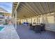 Covered outdoor deck with lounge seating and dining set at 97 Kettle Harbor Dr, Placida, FL 33946