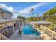 Stunning outdoor pool with a covered bar area and luxurious lounge space, perfect for relaxing and entertaining at 97 Kettle Harbor Dr, Placida, FL 33946
