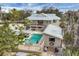 Inviting outdoor pool features swim-up bar and poolside cabana, perfect for entertaining and relaxation at 97 Kettle Harbor Dr, Placida, FL 33946
