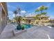 Relaxing pool area with a swim-up bar and lush landscaping creating a private oasis for outdoor enjoyment at 97 Kettle Harbor Dr, Placida, FL 33946