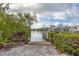 Waterfront access with a boat dock, a boat lift, and plenty of space for recreation at 97 Kettle Harbor Dr, Placida, FL 33946