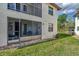 Exterior view of home with screened lanai and well-maintained landscaping at 511 Pine Hollow Cir # 511, Englewood, FL 34223