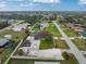 An aerial view of the property showcasing its large lot, exterior features and neighborhood at 10075 Bay Ave, Englewood, FL 34224