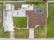 Expansive aerial view showcasing the home's layout, pool, and meticulously landscaped yard at 10075 Bay Ave, Englewood, FL 34224