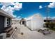 View of the backyard featuring a storage shed, picnic table, and white gravel at 10075 Bay Ave, Englewood, FL 34224