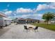 Backyard area featuring a fire pit and shed on a gravel surface at 10075 Bay Ave, Englewood, FL 34224