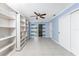 Bright bonus room with tile floor, fan, and sliding glass doors leading to the pool area at 10075 Bay Ave, Englewood, FL 34224