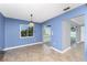 Bright dining room with tile flooring and a view of the screened-in lanai at 10075 Bay Ave, Englewood, FL 34224