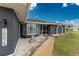 Attractive single story home exterior boasting well-maintained landscaping, stone accents, and visible house numbers at 10075 Bay Ave, Englewood, FL 34224