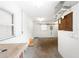 Clean, empty garage space, offering potential for storage, workshop, or hobby area with natural light from two windows at 10075 Bay Ave, Englewood, FL 34224