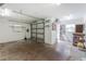 Functional garage interior with a workbench, storage shelves, and ample space for vehicles at 10075 Bay Ave, Englewood, FL 34224