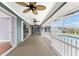 The lanai has screens, several ceiling fans, and a view of the pool at 10075 Bay Ave, Englewood, FL 34224