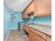 Functional laundry room with modern appliances and ample counter space at 10075 Bay Ave, Englewood, FL 34224