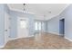 Bright, open living room with tile flooring and a large window for plenty of natural light at 10075 Bay Ave, Englewood, FL 34224