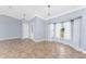 Bright, open living room with tile flooring and a large window for plenty of natural light at 10075 Bay Ave, Englewood, FL 34224