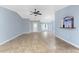 Spacious living room featuring tile floors, neutral colors, and an open layout with natural light at 10075 Bay Ave, Englewood, FL 34224