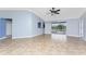 Bright living room with tile floors and access to the pool area at 10075 Bay Ave, Englewood, FL 34224