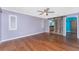 Serene main bedroom with wood floors and a decorative sliding barn door at 10075 Bay Ave, Englewood, FL 34224