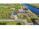 Gorgeous aerial view of home and property showcasing the neighborhood canal in the backyard at 10498 Bay State Dr, Port Charlotte, FL 33981