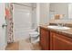 Bright bathroom featuring a shower over tub, neutral decor and a single vanity at 10498 Bay State Dr, Port Charlotte, FL 33981
