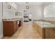 Bright bathroom features a soaking tub, double vanity, and glass enclosed shower at 10498 Bay State Dr, Port Charlotte, FL 33981