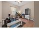 This versatile bedroom is currently set up as a personal gym with wood floors and neutral colored walls at 10498 Bay State Dr, Port Charlotte, FL 33981