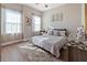 Cozy bedroom with natural light from the two windows and decorative artwork at 10498 Bay State Dr, Port Charlotte, FL 33981
