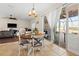 Cozy dining area with a round table, patio access, and ample natural light at 10498 Bay State Dr, Port Charlotte, FL 33981