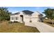 Beautiful single-Gathering home featuring a well-maintained lawn and two-car garage with elegant curb appeal at 10498 Bay State Dr, Port Charlotte, FL 33981