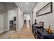Inviting hallway with neutral paint, tile flooring and natural light at 10498 Bay State Dr, Port Charlotte, FL 33981