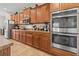 Bright kitchen features stainless steel appliances, granite counters, and dark wood cabinetry at 10498 Bay State Dr, Port Charlotte, FL 33981