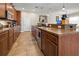 Spacious kitchen featuring wooden cabinets, stainless steel appliances, and a large center island at 10498 Bay State Dr, Port Charlotte, FL 33981