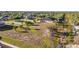 Expansive lot with palm trees, green spaces and adjacent residence, a prime canvas for your dream home at 10498 Bay State Dr, Port Charlotte, FL 33981