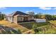 A shot of the rear exterior from afar showcasing the outdoor pool and fencing at 10498 Bay State Dr, Port Charlotte, FL 33981