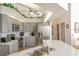 Bright kitchen with stylish gray cabinets, stainless steel appliances, and a spacious countertop at 108 Fairway Rd, Rotonda West, FL 33947