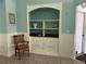 Coastal-themed built-in shelving adding a touch of nautical charm to the living space at 108 Fairway Rd, Rotonda West, FL 33947