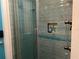 This stylish shower features decorative tile, a built-in niche and sleek glass doors at 108 Fairway Rd, Rotonda West, FL 33947