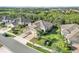 Aerial view of a neighborhood showcasing lush landscaping, manicured lawns and sidewalks at 11417 Okaloosa Dr, Venice, FL 34293