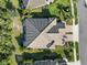 Overhead view of a tile roof home with a landscaped yard and beautiful surroundings at 11417 Okaloosa Dr, Venice, FL 34293