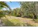 Expansive backyard showcasing lush greenery, providing privacy and serene natural views at 11417 Okaloosa Dr, Venice, FL 34293