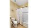 Bright bathroom featuring a shower-tub combo with decorative tiling and a modern curtain rod at 11417 Okaloosa Dr, Venice, FL 34293