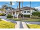 Charming community clubhouse with blue shutters and a beautifully landscaped entrance at 11417 Okaloosa Dr, Venice, FL 34293