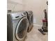 Laundry room featuring modern, front-loading Samsung washer and dryer units at 11417 Okaloosa Dr, Venice, FL 34293