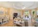 Bright living space featuring a dining area, neutral color palette, and access to the outdoor patio at 11417 Okaloosa Dr, Venice, FL 34293