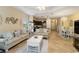 Open-concept living space seamlessly connects the living room, kitchen, and dining area at 11417 Okaloosa Dr, Venice, FL 34293